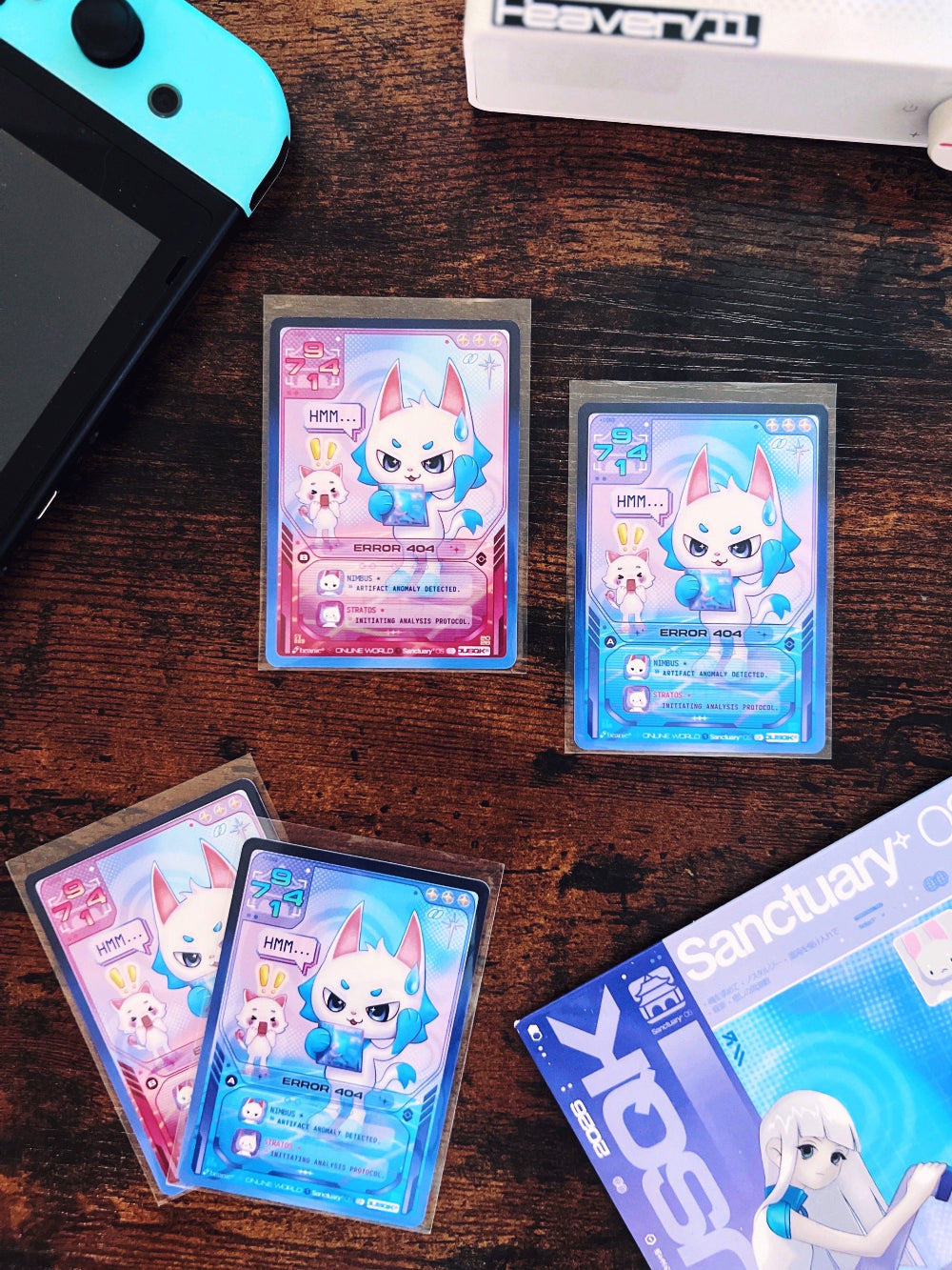 Four "Error 404" trading cards with gaming console, CD player, and Sanctuary OS CD in background